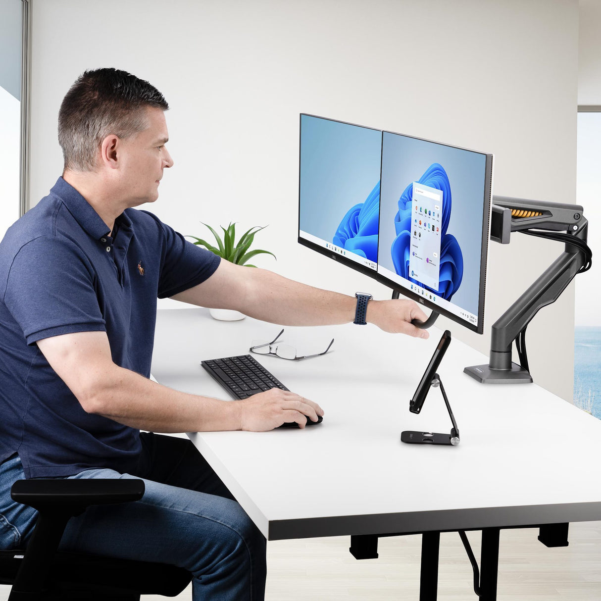 StarTech.com Desk Mount Dual Monitor Arm with Crossbar, Up To 27" Displays, VESA 75x75/100x100, Max 33lb/15kg, C-Clamp, Fully Articulating, Mechanical Spring, TAA